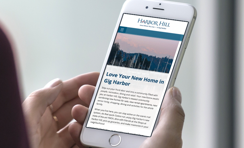 Image of iphone mockup with Harbor Hill mobile website design