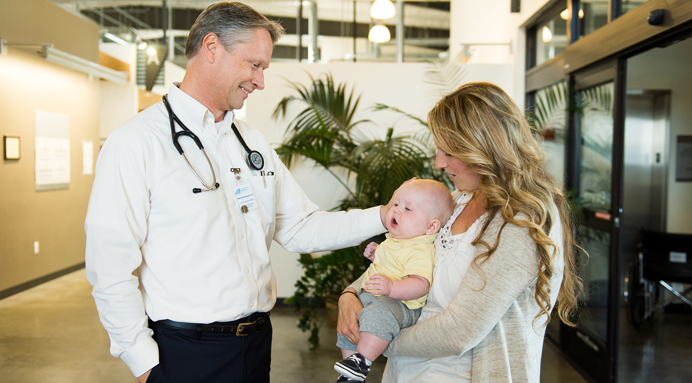 Custom photoshoot with doctor, mom, and baby