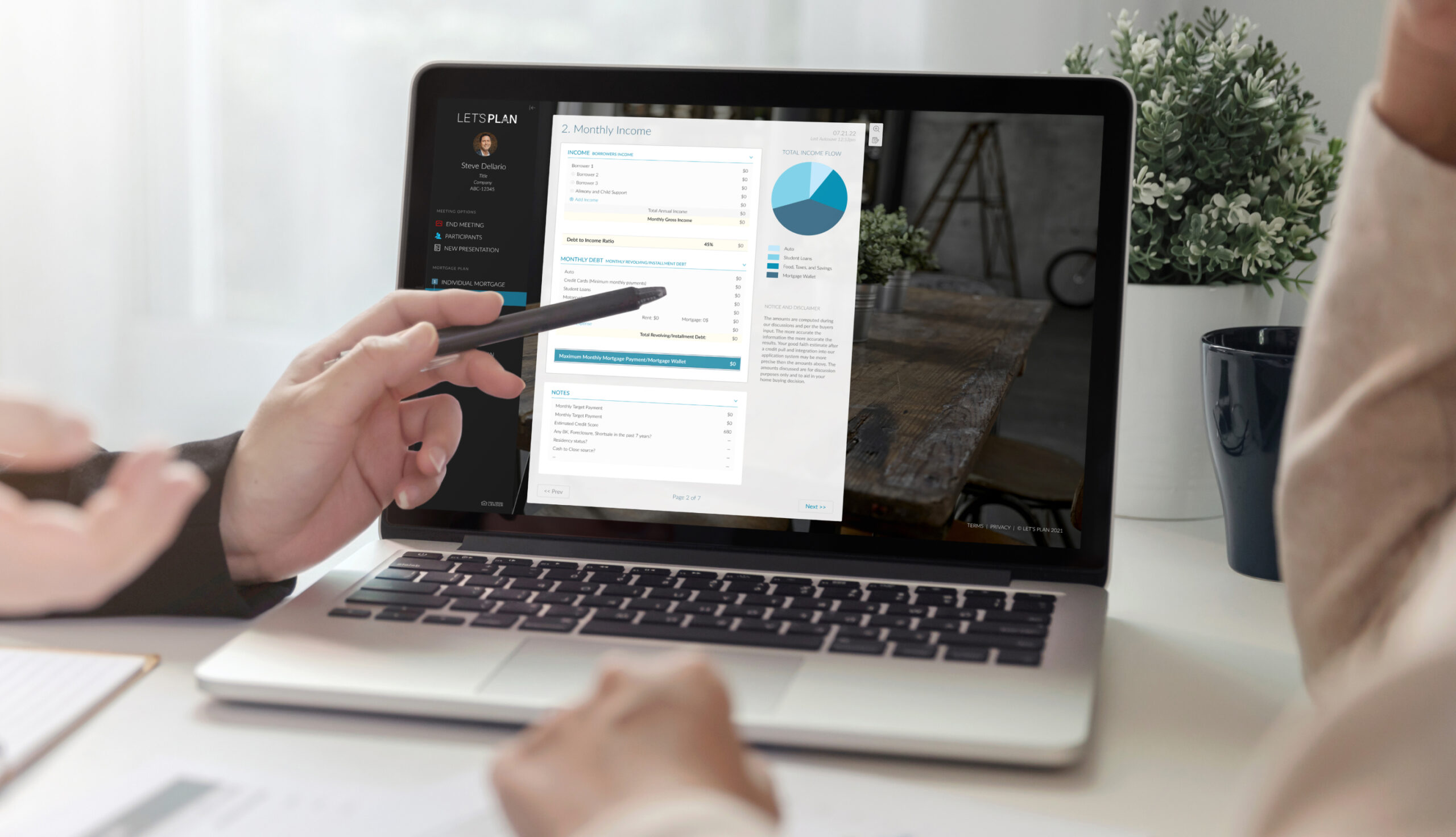 Person showcasing a demo of the LP Loan Planner™ application on a laptop device