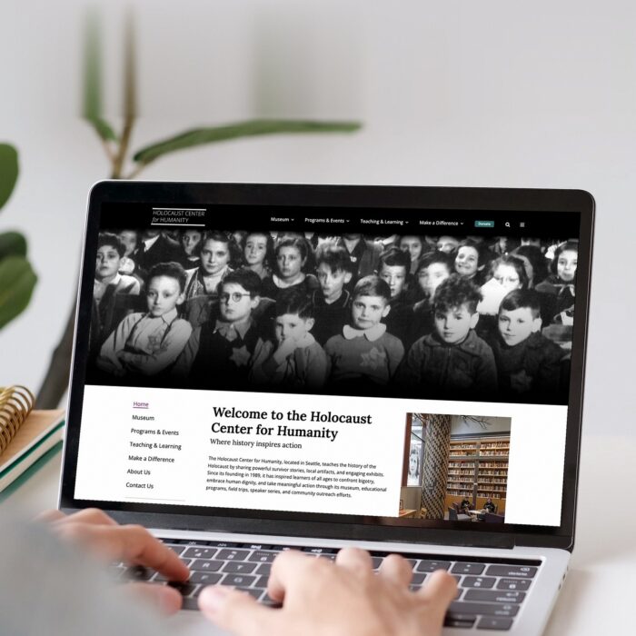 Holocaust Center for Humanity website and digital transformation by Jennergy shown on desktop.